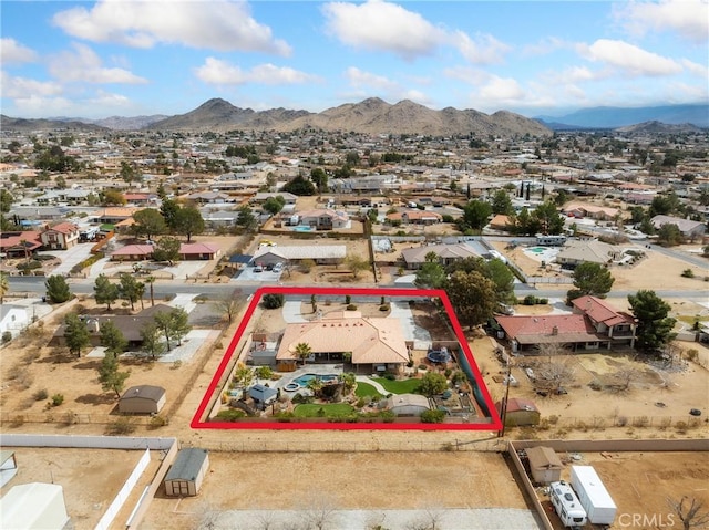 drone / aerial view featuring a mountain view and a residential view