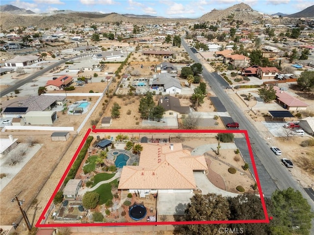 aerial view featuring a mountain view and a residential view