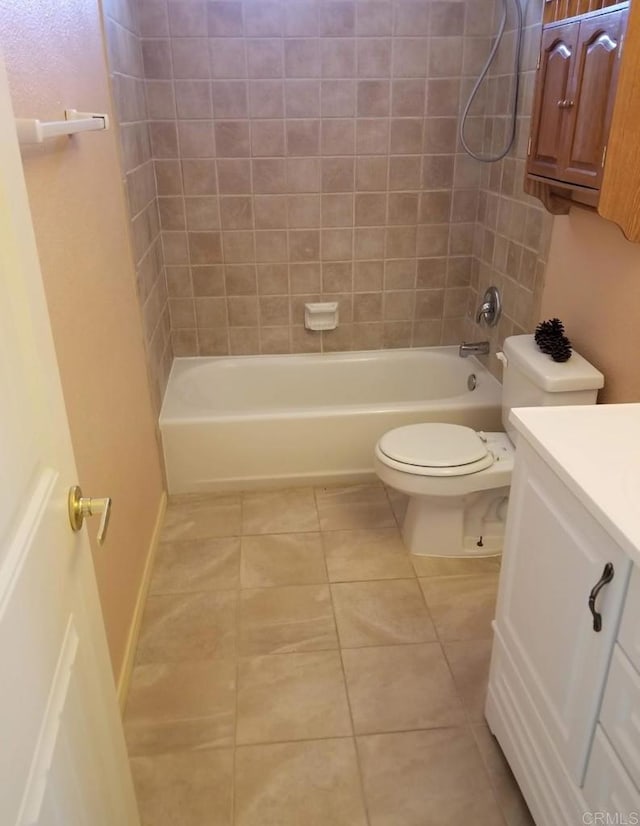 full bath featuring bathing tub / shower combination, tile patterned floors, vanity, and toilet