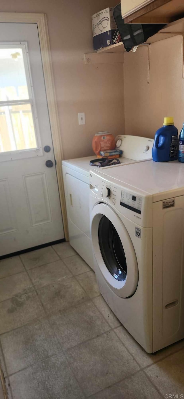 laundry area featuring washer and clothes dryer and laundry area