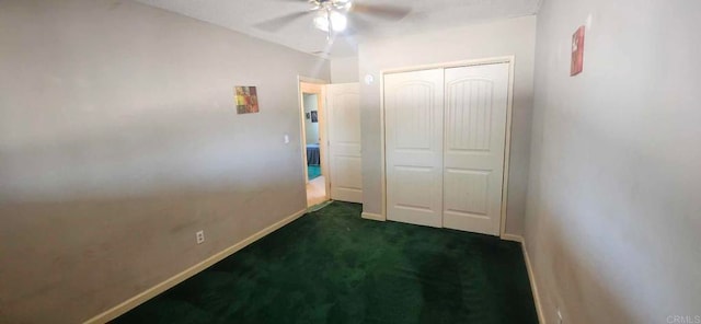 44600 Brawley Ave, Jacumba, CA 91934 - unfurnished bedroom featuring dark colored carpet, a closet, baseboards, and a ceiling fan