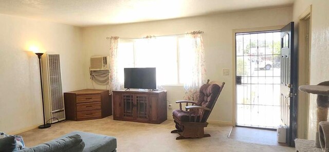 44600 Brawley Ave, Jacumba, CA 91934 - living area with a heating unit, light carpet, an AC wall unit, and baseboards