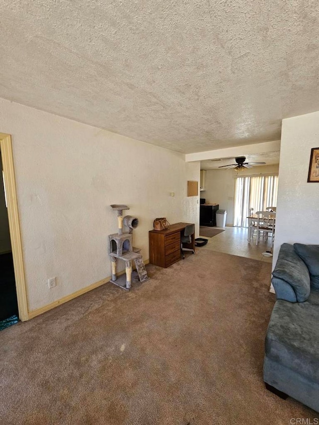 44600 Brawley Ave, Jacumba, CA 91934 - unfurnished living room with a textured ceiling, a ceiling fan, and carpet flooring