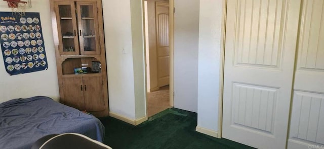 44600 Brawley Ave, Jacumba, CA 91934 - bedroom featuring dark colored carpet, a closet, and baseboards