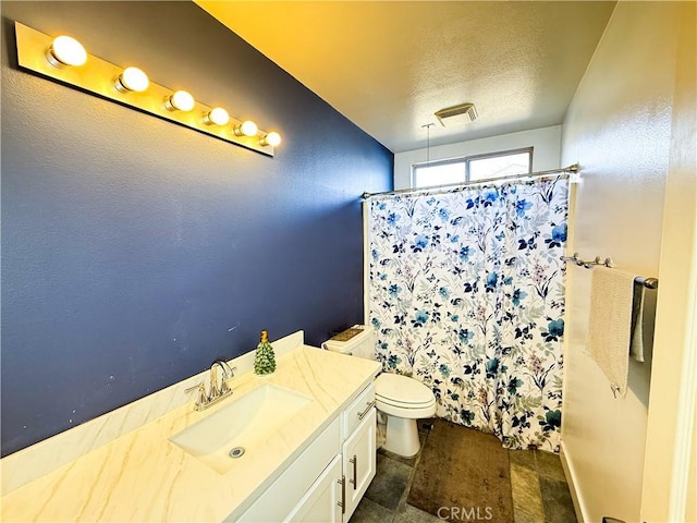 bathroom with visible vents, a shower with curtain, toilet, a textured ceiling, and vanity