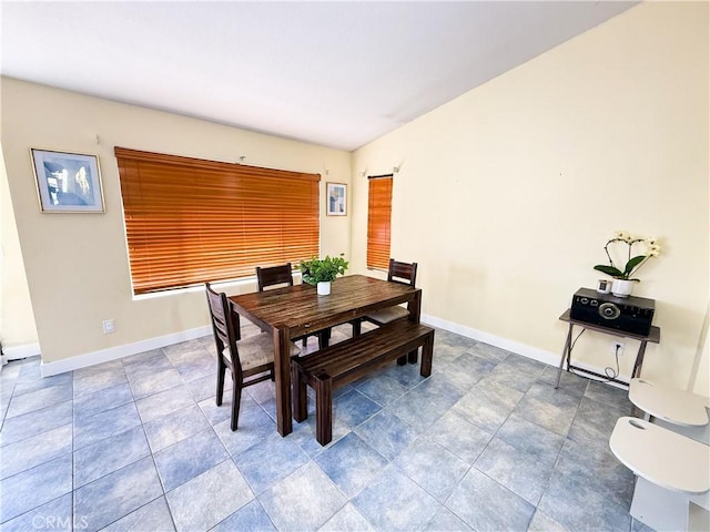 dining area featuring baseboards