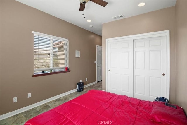 bedroom featuring a ceiling fan, visible vents, baseboards, recessed lighting, and a closet