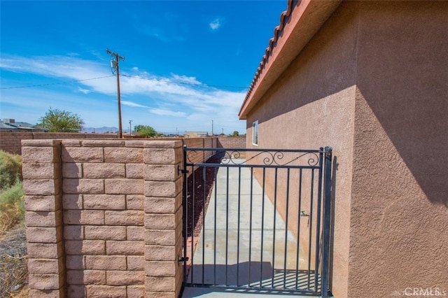 view of gate with fence