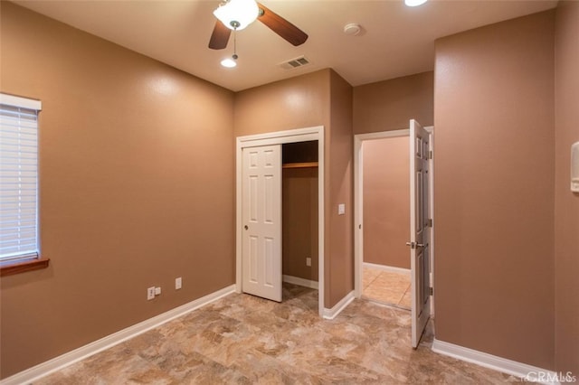 unfurnished bedroom with visible vents, baseboards, a closet, and a ceiling fan