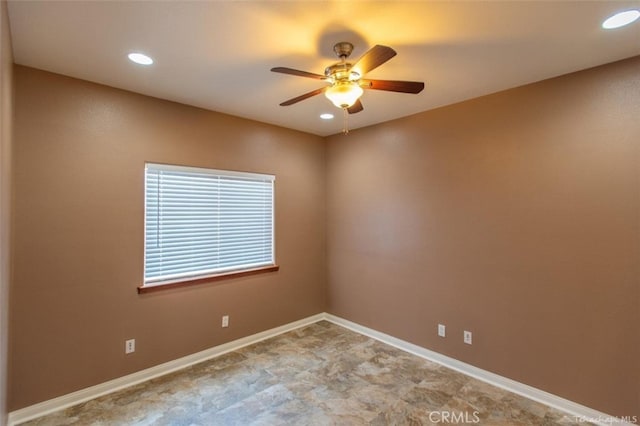 spare room featuring recessed lighting, a ceiling fan, and baseboards