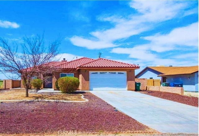 single story home featuring stucco siding, driveway, fence, a garage, and a tiled roof