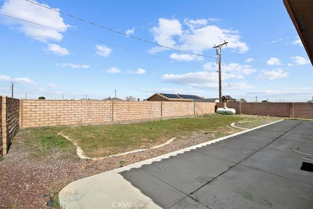 view of yard featuring a fenced backyard