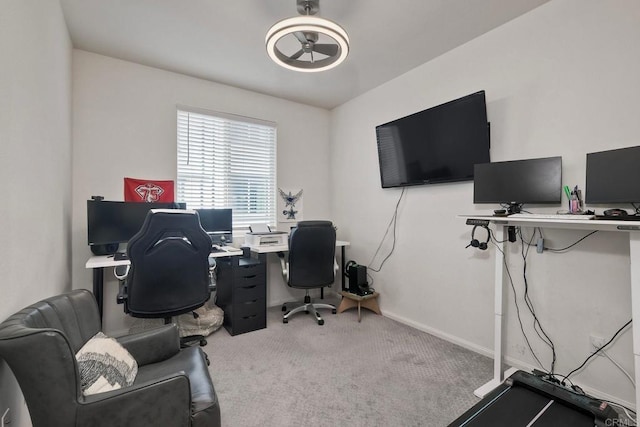 carpeted office featuring baseboards