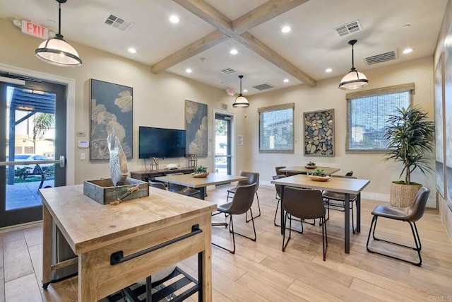 dining space featuring baseboards, beamed ceiling, visible vents, and light wood-style flooring