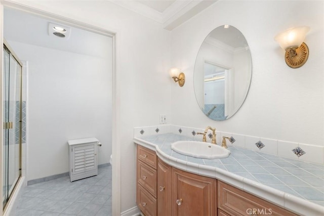 full bath featuring vanity, baseboards, a stall shower, ornamental molding, and toilet