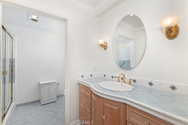 full bathroom featuring vanity, tile patterned floors, toilet, a stall shower, and ornamental molding
