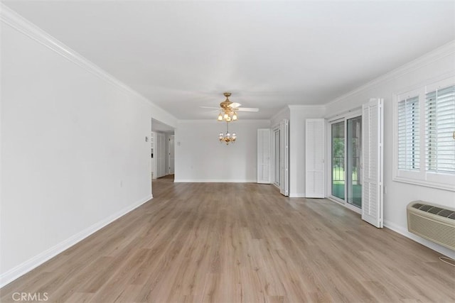 5519 Paseo Del Lago E Unit 2H, Laguna Woods, CA 92637 - unfurnished living room featuring light wood-style flooring, ornamental molding, a ceiling fan, baseboards, and an AC wall unit