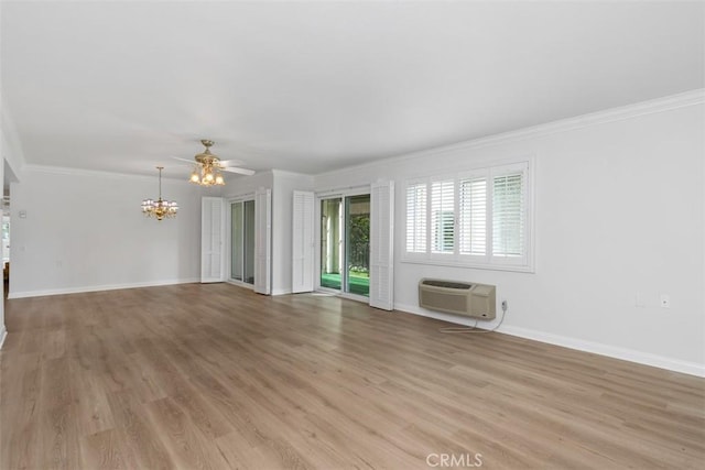 unfurnished living room with ornamental molding, ceiling fan with notable chandelier, baseboards, and light wood-type flooring