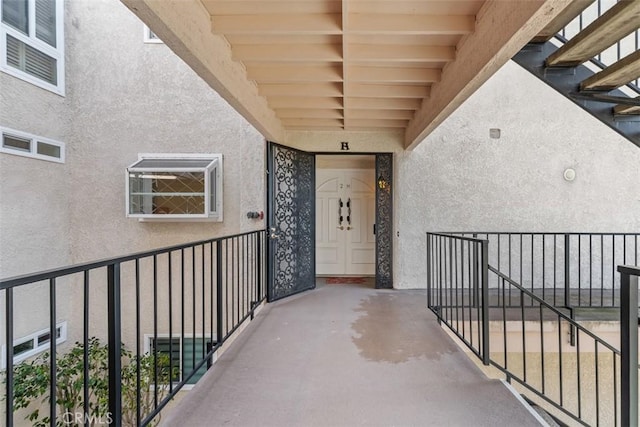 entrance to property with stucco siding