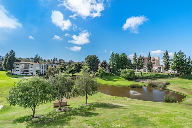 5519 Paseo Del Lago E Unit 2H, Laguna Woods, CA 92637 - surrounding community featuring a water view, view of golf course, and a yard