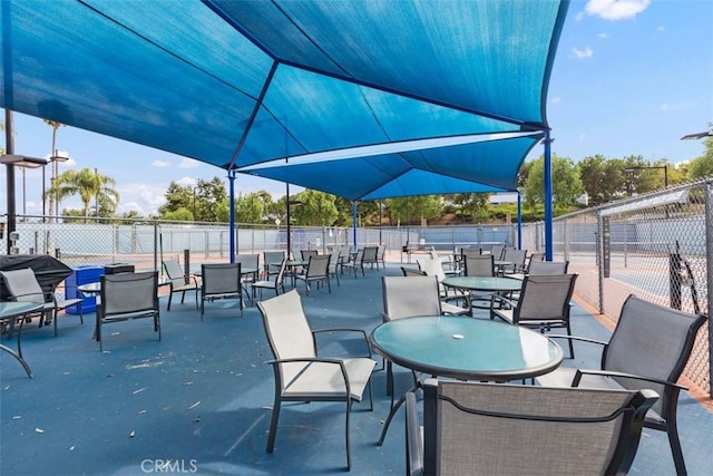 view of patio featuring fence