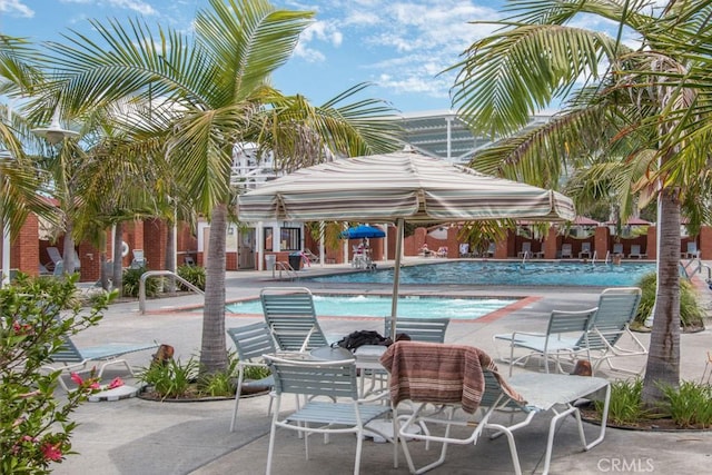 community pool with a patio area