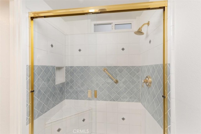 bathroom featuring a shower stall