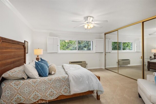 5519 Paseo Del Lago E Unit 2H, Laguna Woods, CA 92637 - bedroom with a closet, carpet floors, a wall mounted air conditioner, crown molding, and baseboards