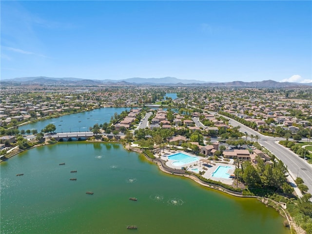 bird's eye view with a residential view and a water and mountain view