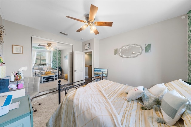 bedroom featuring a closet, visible vents, and ceiling fan