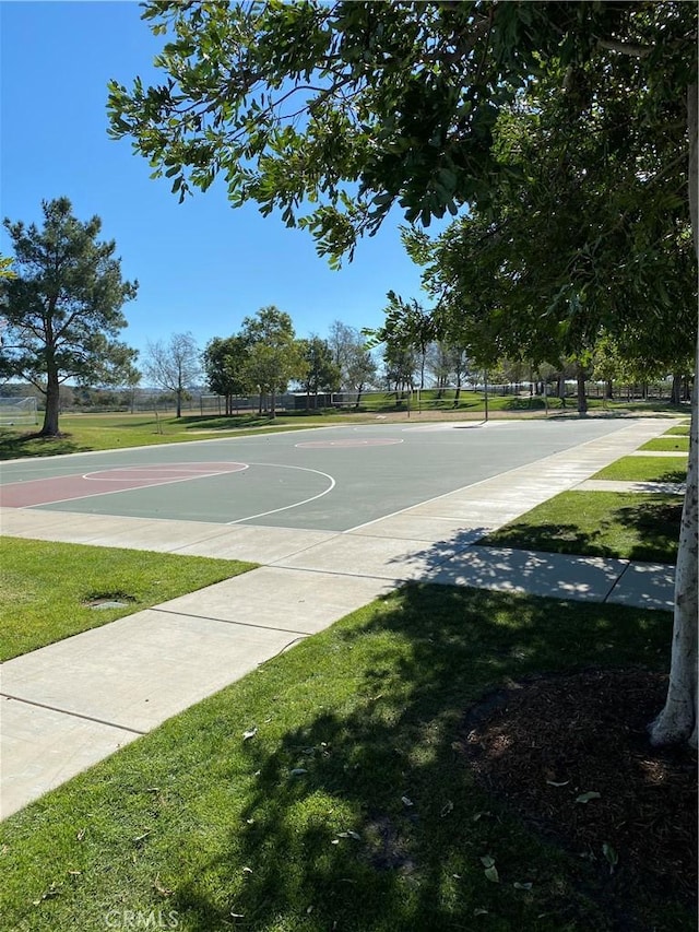 view of sport court with a yard and community basketball court