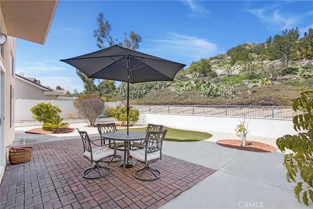 view of patio / terrace featuring outdoor dining area and a fenced backyard