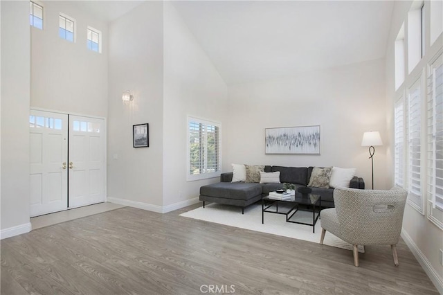 living room featuring baseboards and wood finished floors