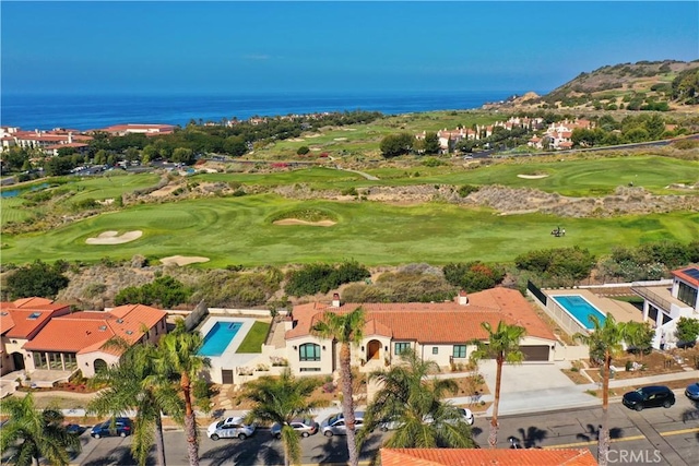 aerial view with a water view and golf course view