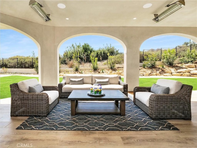 view of patio featuring an outdoor hangout area and a fenced backyard