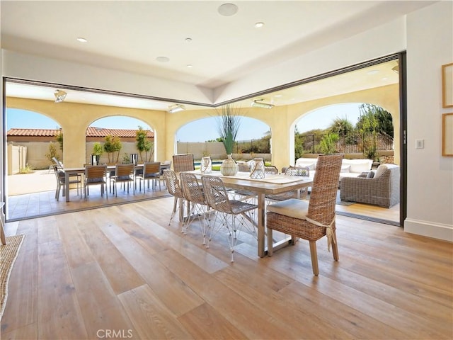 view of patio with outdoor dining space and fence