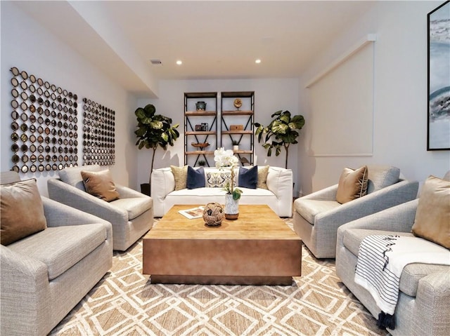 living area with recessed lighting and visible vents