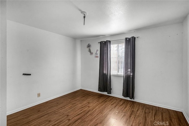 822 E 87th Pl, Los Angeles, CA 90002 - empty room with wood finished floors and baseboards