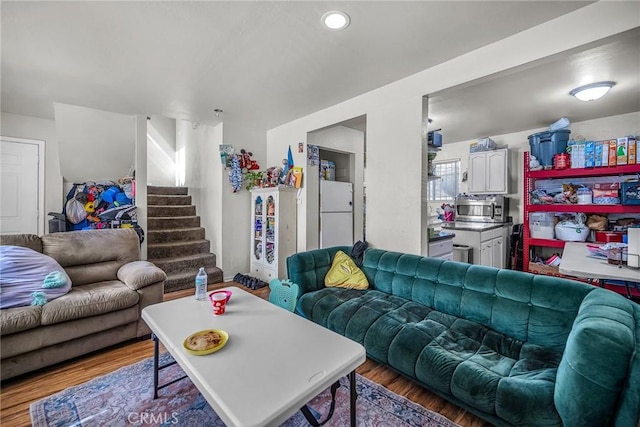 822 E 87th Pl, Los Angeles, CA 90002 - living area with wood finished floors, stairs, and recessed lighting
