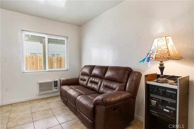 living room with light tile patterned floors, baseboards, and a wall unit AC