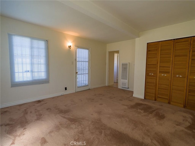 interior space with visible vents, baseboards, and carpet floors