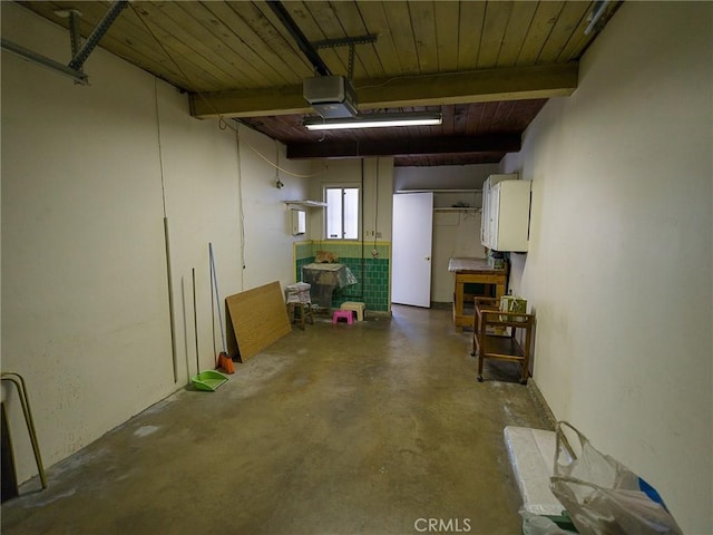 garage with wooden ceiling and a garage door opener