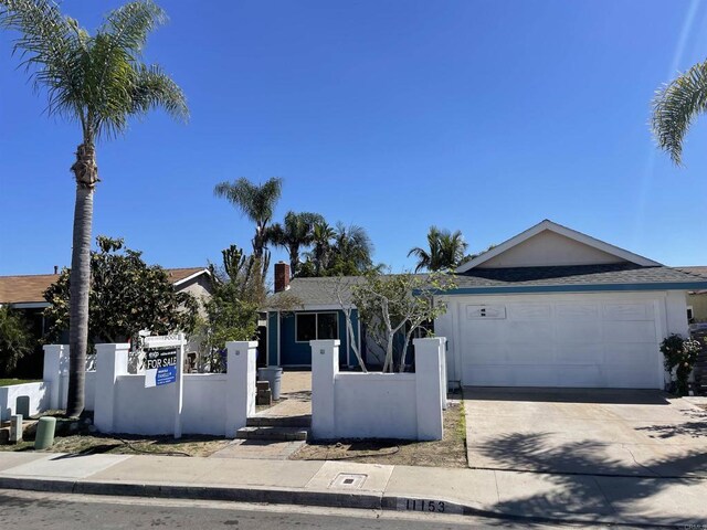 ranch-style home with a chimney, a fenced front yard, a garage, concrete driveway, and stucco siding