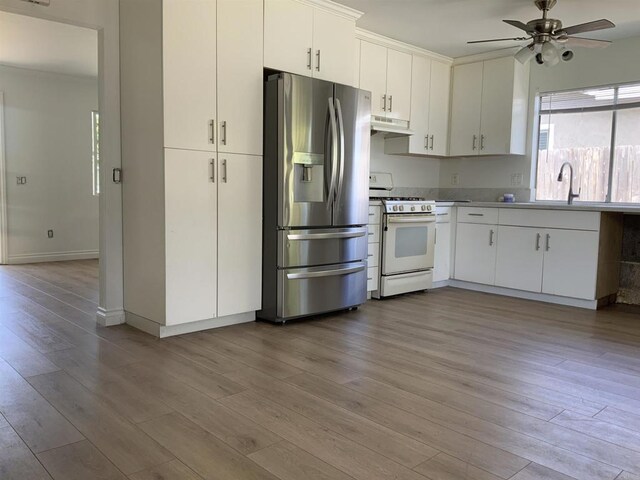 kitchen with ceiling fan, white gas stove, stainless steel refrigerator with ice dispenser, wood finished floors, and under cabinet range hood