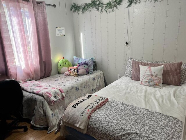 bedroom with wood finished floors