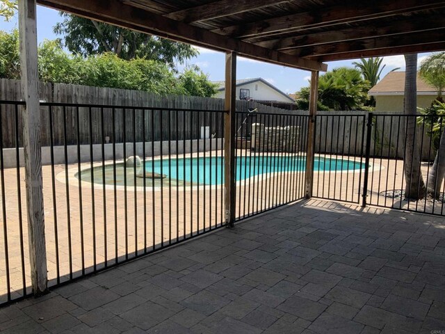 view of pool with a fenced in pool, a fenced backyard, and a patio area