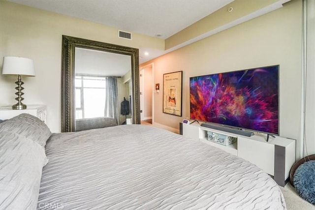 bedroom featuring visible vents and carpet floors