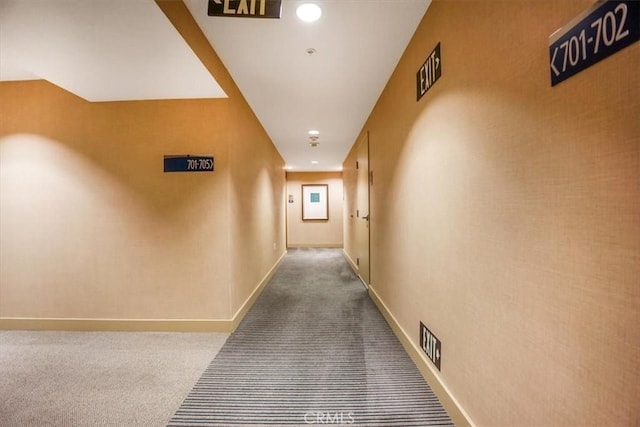 corridor with visible vents, recessed lighting, baseboards, and carpet