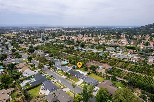 birds eye view of property with a residential view