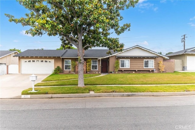 ranch-style home with an attached garage, concrete driveway, a front yard, and fence